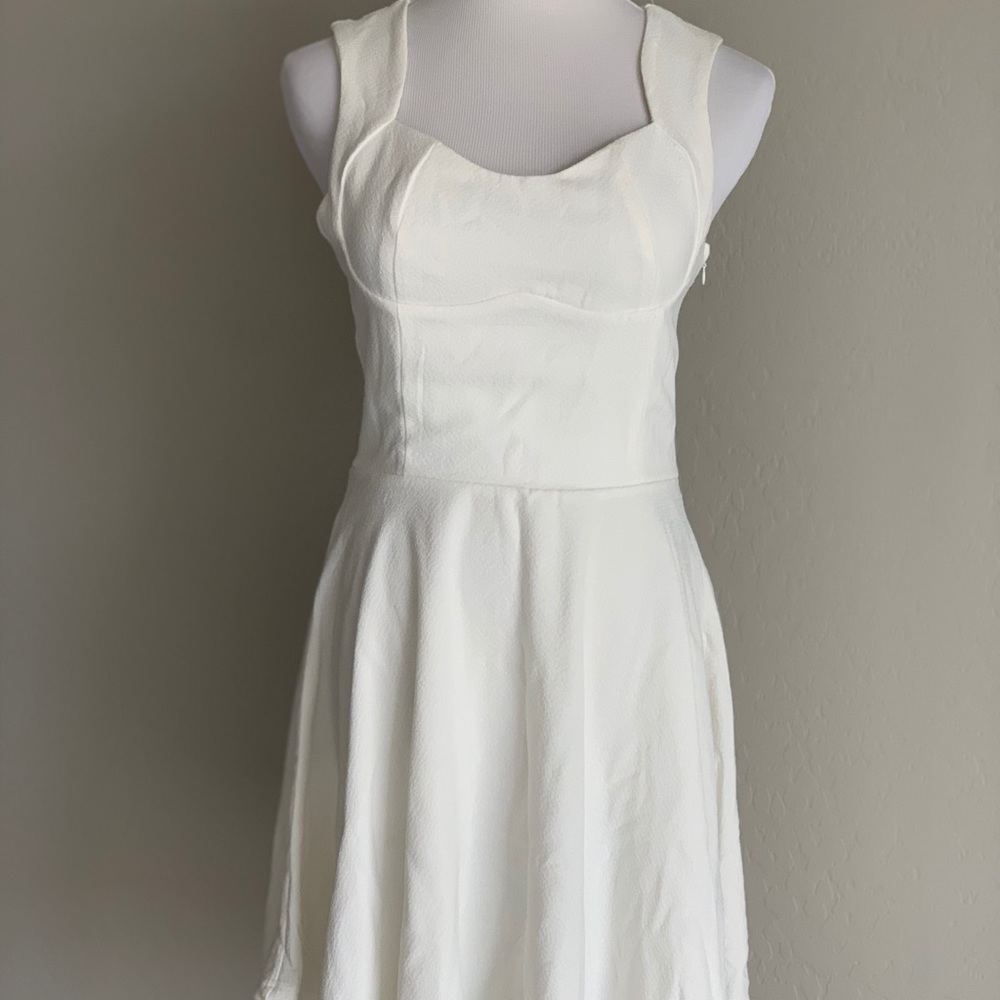 White sleeveless skater dress